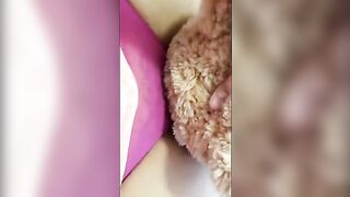 A girl is humping a teddy bear and getting very excited