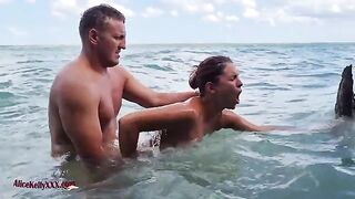 A couple enjoy amazing sex in the outdoor pool of a luxurious blue lagoon