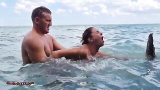 A couple enjoy amazing sex in the outdoor pool of a luxurious blue lagoon
