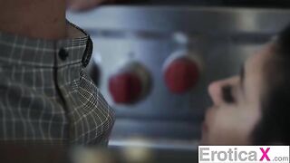 The pretty woman has sex with her husband in the kitchen