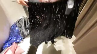 The hot girl is trying on dresses in the fitting room and gets fucked hard
