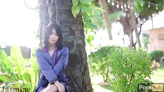 A cute Asian girl masturbates with a dildo and vibrator in the garden