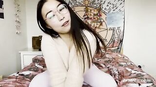 A happy Chinese girl playing with her pussy in front of the camera