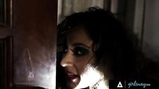 An investigator, Riley Reid, gets intimate with a hooker, Reena Sky, on the couch