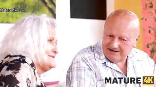 A mature woman seduces her husband’s friend at the table