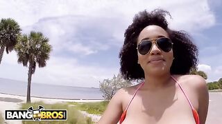 The girl is riding a bike and her boobs are bouncing beautifully