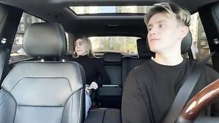 A girl paid for a taxi ride with her mouth in the car outdoors