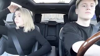 A girl paid for a taxi ride with her mouth in the car outdoors