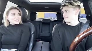A girl paid for a taxi ride with her mouth in the car outdoors