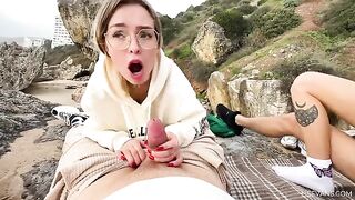 Two beautiful 18-year-old girls are having fun on the beach with a guy