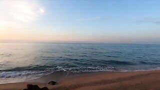 A girl is having fun on the beach with a guy she just met