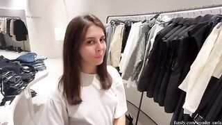 A girl is trying on clothes in the fitting room and gets fucked there