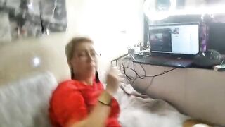 A mature woman is playing with her pussy on camera, showcasing real orgasm