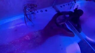 A blonde is indulging in solo play with toys in the bathroom