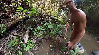 The couple has sex right in the river surrounded by a jungle