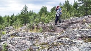 A babe is having sex directly on a stone in nature, it's very beautiful
