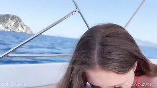 A girl was having fun with her friend on a yacht, while someone else was nearby