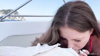 A girl was having fun with her friend on a yacht, while someone else was nearby