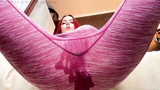 The sexy girl is doing yoga and playing with her pussy, showcasing her petite frame