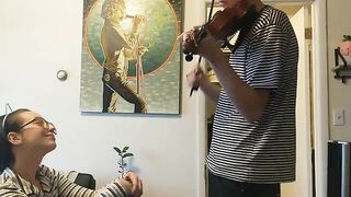 Trying to practice violin with my girlfriend, passionate action