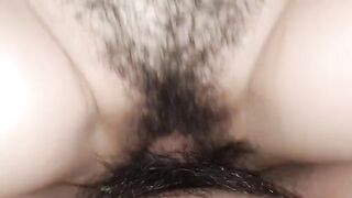 A woman’s wet pussy is filled with cum, creating a creamy cumshot