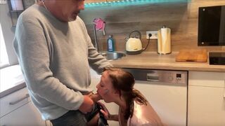 The husband does not notice anything when his wife gets fucked in the kitchen