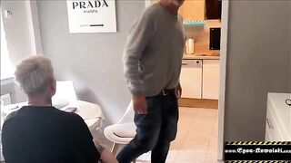 The husband does not notice anything when his wife gets fucked in the kitchen
