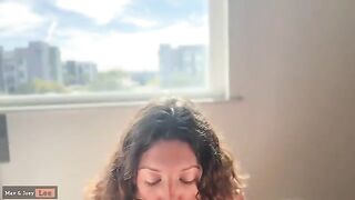 A cute woman gave a blowjob and fucked in front of the window