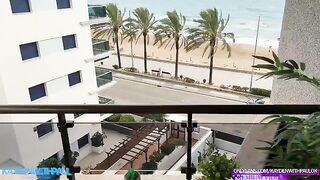 A couple engages in passionate sex right on the balcony, with the sea as their witness