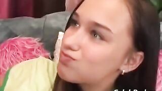 A cute girl has sex with her adult friend on the couch