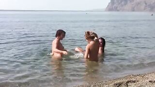 Three hot girls with shaved pussy on a nude beach