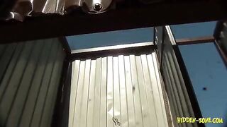 Spy camera footage of a woman in a beach house