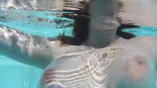 Girl plays with dildo in her pussy in the swimming pool