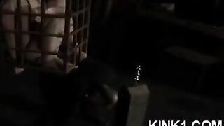 A slave in a cage fulfills all the orders of its master