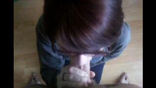 The girl sank to the ground and began to work on her new job, sucking penises