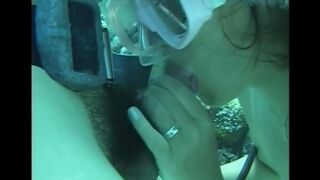 A guy has sex with a girl right in the swimming pool water