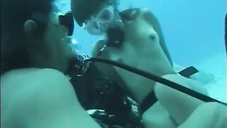 A guy has sex with a girl right in the swimming pool water