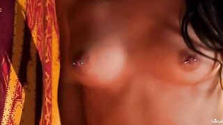 A chick with a nipple piercing plays with her fingers