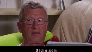 A young girl is having fun with older men in this hot video