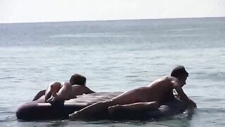 A naked woman has sex on the beach with a complete stranger