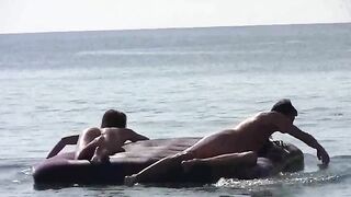 A naked woman has sex on the beach with a complete stranger