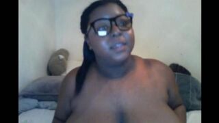 The black woman closed the camera with her big natural tits during a steamy show