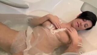 Brunette woman with long hair has sex with herself