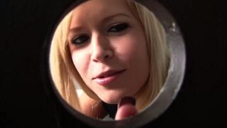 Blonde woman sucks cock through a hole in the toilet bowl, getting cum on her face