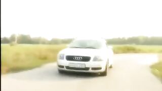 A girl with a shaved pussy on the bonnet