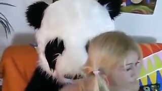 A hot girl fucks with a bear in the form of Panda