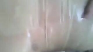 Putting a condom on a dick and jerking off with your hand
