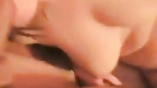 Spreading legs to show off a naked pussy with a prominent clitoris