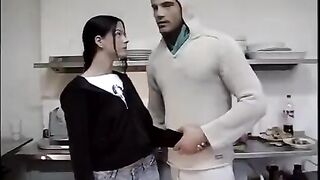 A couple has sex right in the kitchen, no longer able to restrain their desires