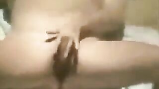 A woman masturbates on the beach with a hidden camera